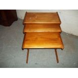 A VINTAGE RETRO TEAK NEST OF THREE TABLES