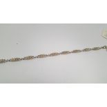 A 9 CT GOLD DIAMOND BRACELET