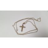 A CROSS ON A SILVER CHAIN