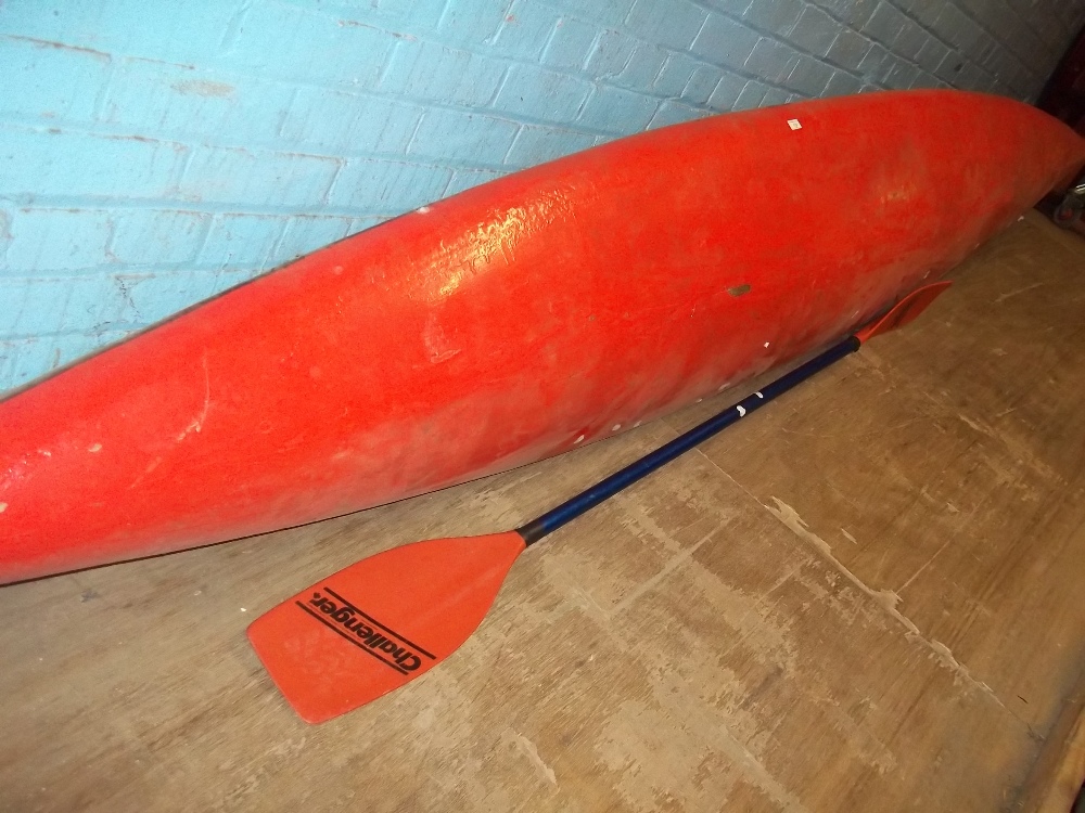 A SINGLE MAN CANOE WITH A DOUBLE ENDED OAR, HELMET ETC. - Image 2 of 3