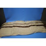 A VINTAGE THREE PANEL BROWN AND CREAM KILIM RUG