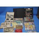 A COLLECTION OF STAMPS, PHOTOGRAPHS, CIGARETTE CARDS ETC.