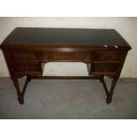 A LEATHER INLAID OAK DESK