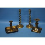 FOUR BRASS CANDLESTICKS