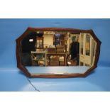 AN OAK FRAMED MIRROR APPROX. 66 X 40 CM