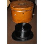 A METAL HAT BOX WITH A BLACK TOP HAT (NO MAKER 'BEST QUALITY' LONDON)