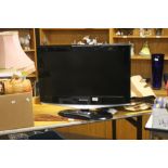 A SAMSUNG 26" FLAT SCREEN TV