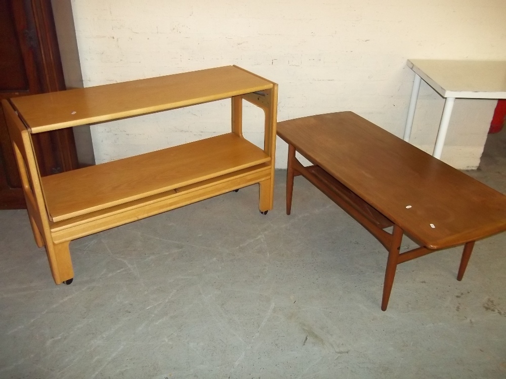 A VINTAGE FOLD OUT TROLLEY TABLE AND A VINTAGE COFFEE TABLE WITH STRETCHER SHELF