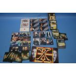 THREE SETS OF X-FILES PHONE CARDS, A SET OF SIGNED TRADING CARDS AND A BOX OF TRADING CARDS