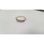 AN 18 CT GOLD FIVE STONE DIAMOND RING