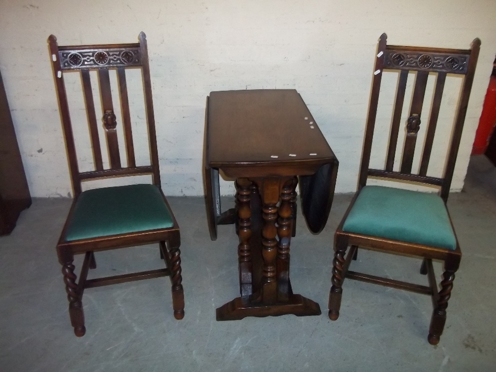 AN OAK DROP LEAF DINING TABLE WITH TWO CHAIRS - Image 2 of 3