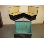 THREE METAL STORAGE TRAVEL TRUNKS