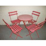 A FOLDING GARDEN PATIO SET WITH FOUR CHAIRS