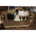 A LARGE GILT MIRROR APPROX. 122 X 90 CM