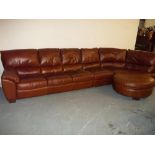 A BROWN LEATHER CORNER SOFA AND POUFFE