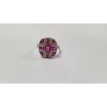 A PLATINUM ART DECO-STYLE PANEL RING SET WITH OVAL-CUT AND CALIBRE-CUT RUBIES AND RBC DIAMONDS,