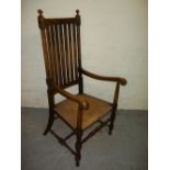 AN ANTIQUE COUNTRY OAK STLE CARVER CHAIR 1920S