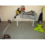 A PETROL LEAF BLOWER, AN ELECTRIC GARDEN VAC AND A PETROL SABRE STRIMMER (3)