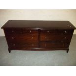 A STAG MINSTREL LOW WIDE EIGHT DRAWER CHEST OF DRAWERS