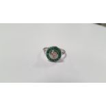 A PLATINUM EMERALD AND DIAMOND TARGET-STYLE RING, CENTRAL RBC DIAMOND APPROX. 0.44 CT,
