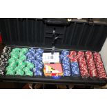 A CASED SET OF POKER CHIPS