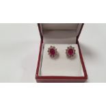 A PAIR OF 18 CT WHITE GOLD RUBY AND DIAMOND CLUSTER STUDS, RUBIES APPROX. 1.9 CT, DIAMONDS APPROX. 1