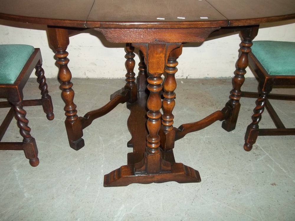 AN OAK DROP LEAF DINING TABLE WITH TWO CHAIRS - Image 3 of 3