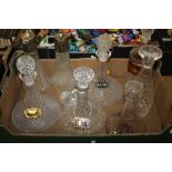 A TRAY OF CUT GLASS DECANTERS SOME WITH DECANTER LABELS (TRAY NOT INCLUDED)