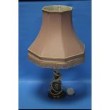 A BRASS LAMP WITH SHADE