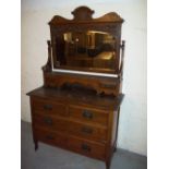 AN ANTIQUE OAK DRESSING TABLE