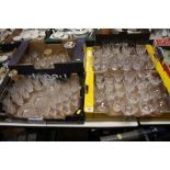FOUR TRAYS OF ASSORTED CRYSTAL DRINKING GLASSES AND DECANTERS ETC.
