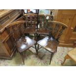 A SET OF FOUR ERCOL 'FLEUR DE LYS' CHAIRS