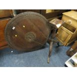 AN ANTIQUE CARVED OAK TILT-TOP PEDESTAL TABLE - DAMAGE TO THE TOP OF THE PEDESTAL