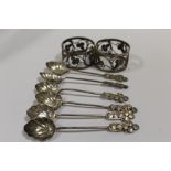 A PAIR OF UNUSUAL WHITE METAL NAPKIN RINGS, TOGETHER WITH A SET OF SIX SIMILAR COFFEE SPOONS