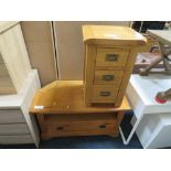 A MODERN OAK THREE DRAWER BEDSIDE CHEST AND A MATCHED LOW TV CABINET (2)