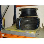 A ROLL OF CABLE AND A PACK OF MATTING