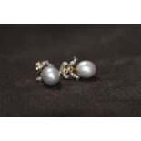 A PAIR OF LARGE GREY PEARL AND DIAMOND BOW TOP EARRINGS, boxed