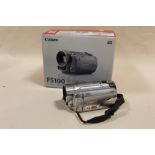 A BOXED CANON FS100 CAMCORDER