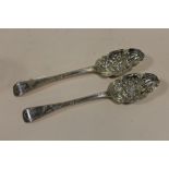 A PAIR OF HALLMARKED SILVER BERRY PATTERN SPOONS APPROX WEIGHT - 148G