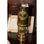 A BRASS THOMAS & WILLIAMS CAMBRIAN MINERS LAMP WITH CERTIFICATE OF AUTHENTICITY