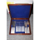 A MAHOGANY CASED SET OF MOTHER OF PEARL HANDLED KNIVES AND FORKS