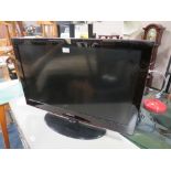 A SAMSUNG 32" FLATSCREEN TV - REMOTE