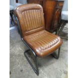 A MODERN BROWN LEATHER DINING CHAIR