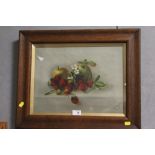 AN OAK FRAMED AND GLAZED OIL ON CANVAS SILL LIFE STUDY OF FRUIT SIGNED L. GROVES 1915