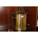 A BRASS EFFECT LIDDED COAL BUCKET