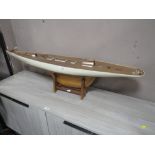 A MODERN WOODEN POND YACHT ON STAND L 126 cm