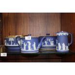 FOUR PIECES OF WEDGWOOD BLUE DIP JASPERWARE COMPRISING CHEESE DOME, TEA POT, FRUIT BOWL WITH