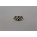 A HALLMARKED 9 CARAT GOLD SEVEN STONE DRESS RING SIZE N APPROX WEIGHT - 3.9G