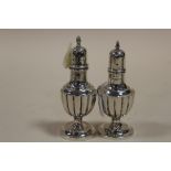 A PAIR OF HALLMARKED SILVER PEPPERETTES APPROX WEIGHT - 55G