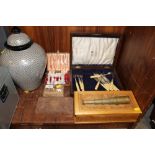 TWO SMALL CUTLERY BOXES AND CONTENTS TOGETHER WITH THREE TREEN LIDDED BOXES AND A SMALL BRASS